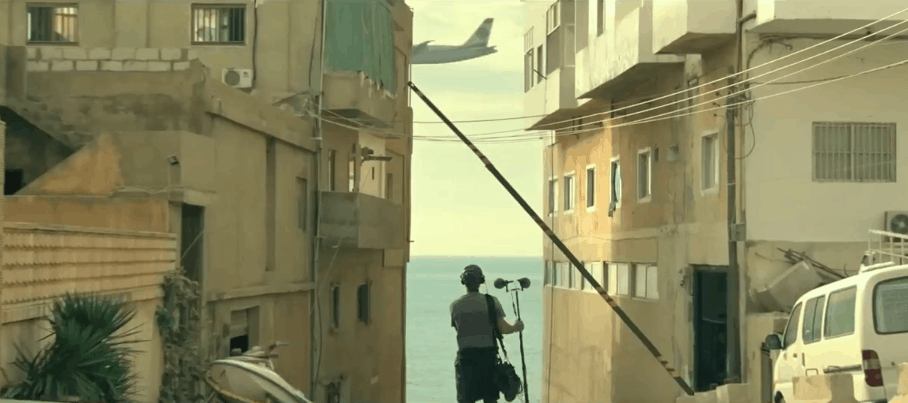 man picking up ambient noise of planes and streets