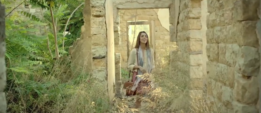 woman in old village ruins