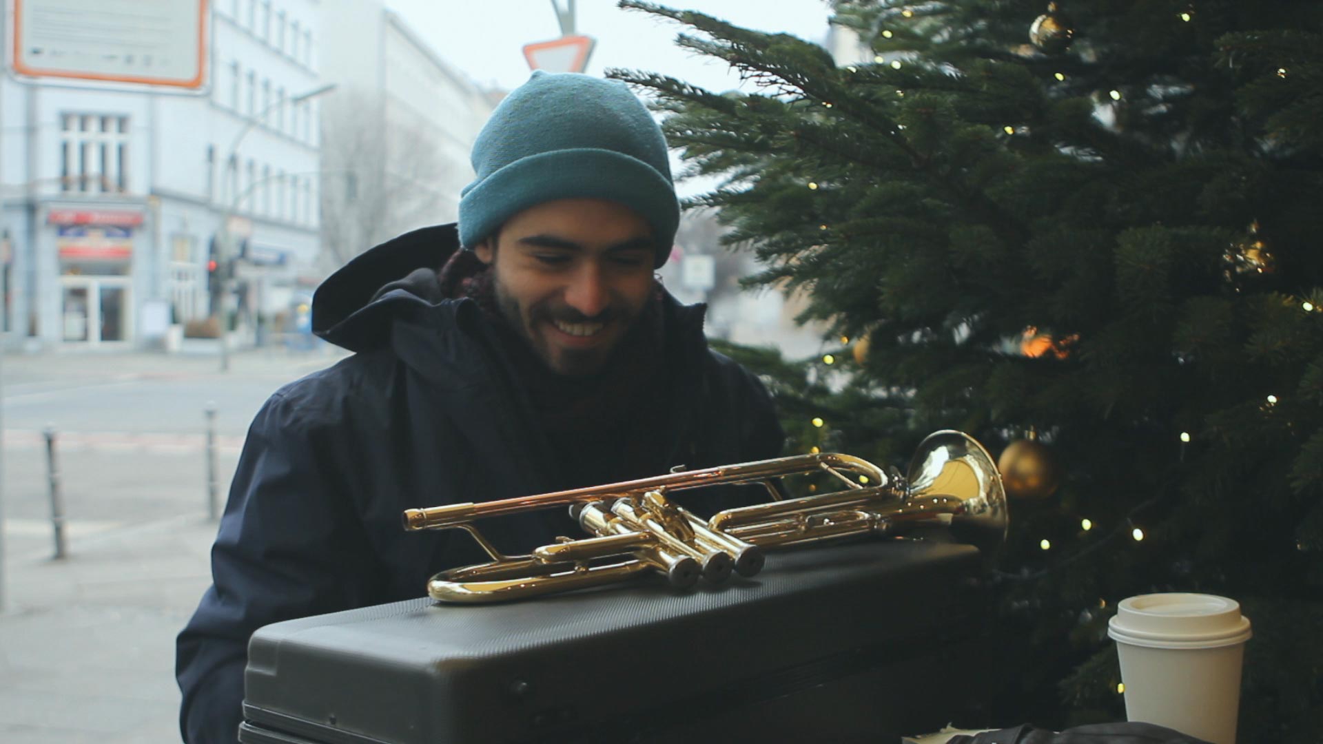 man with a trumpet at a piano